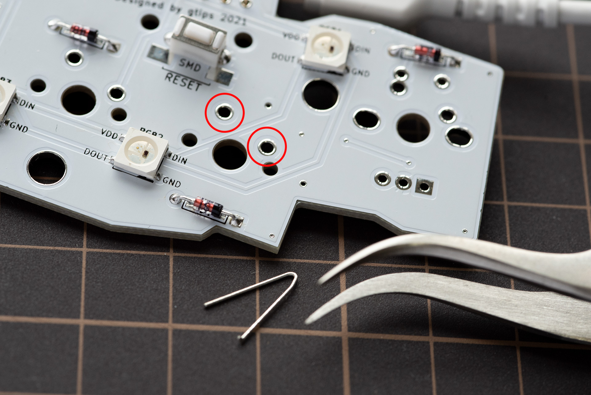 Testing key input by bridging the switch pads with tweezers