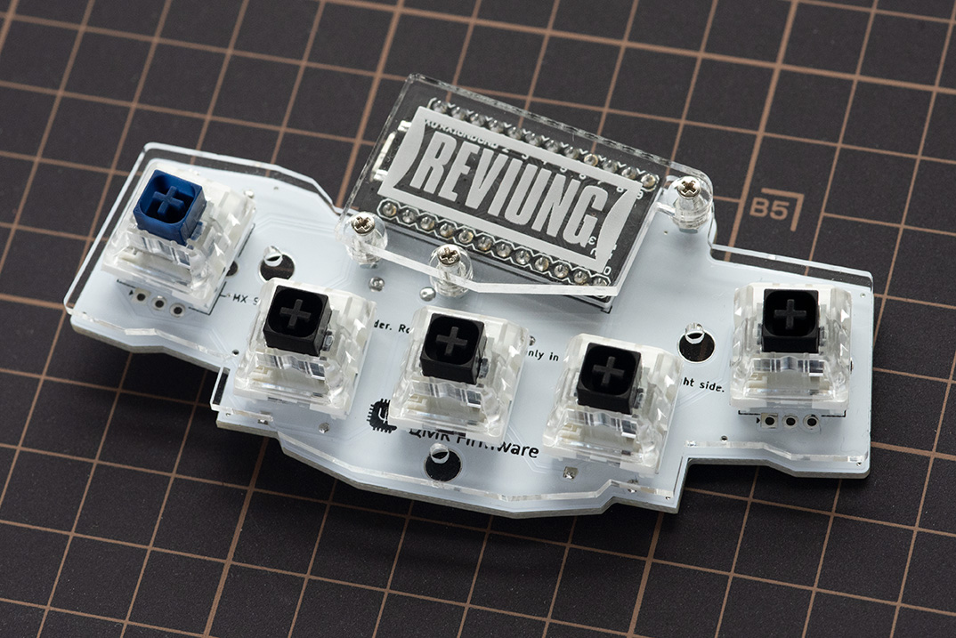Top plate with switches lowered onto the main PCB